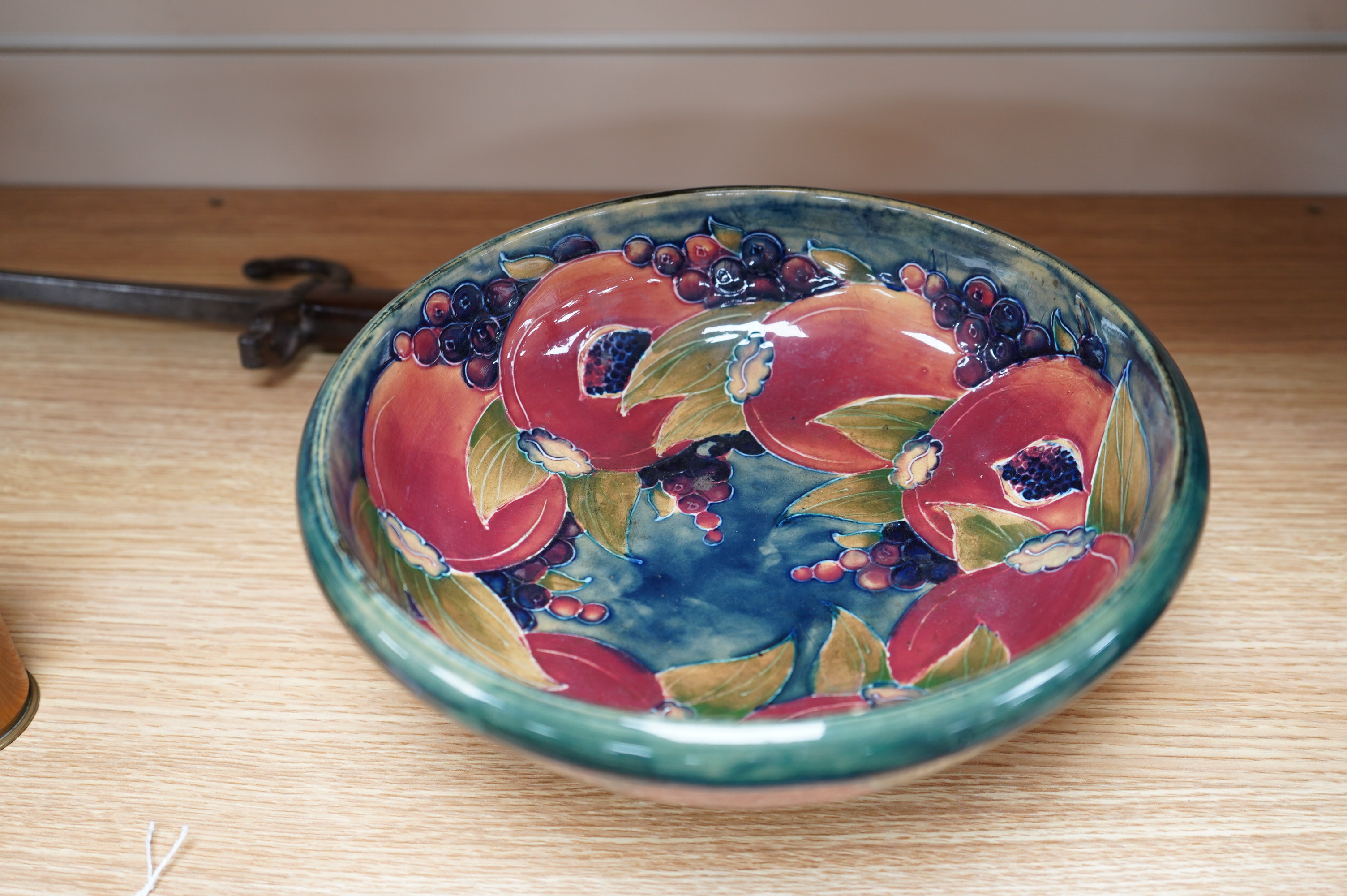 An early Moorcroft pomegranate pattern footed bowl, diameter 23cm.